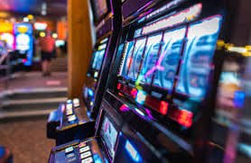 Slot game reels and fish game arcade screens representing playph game categories